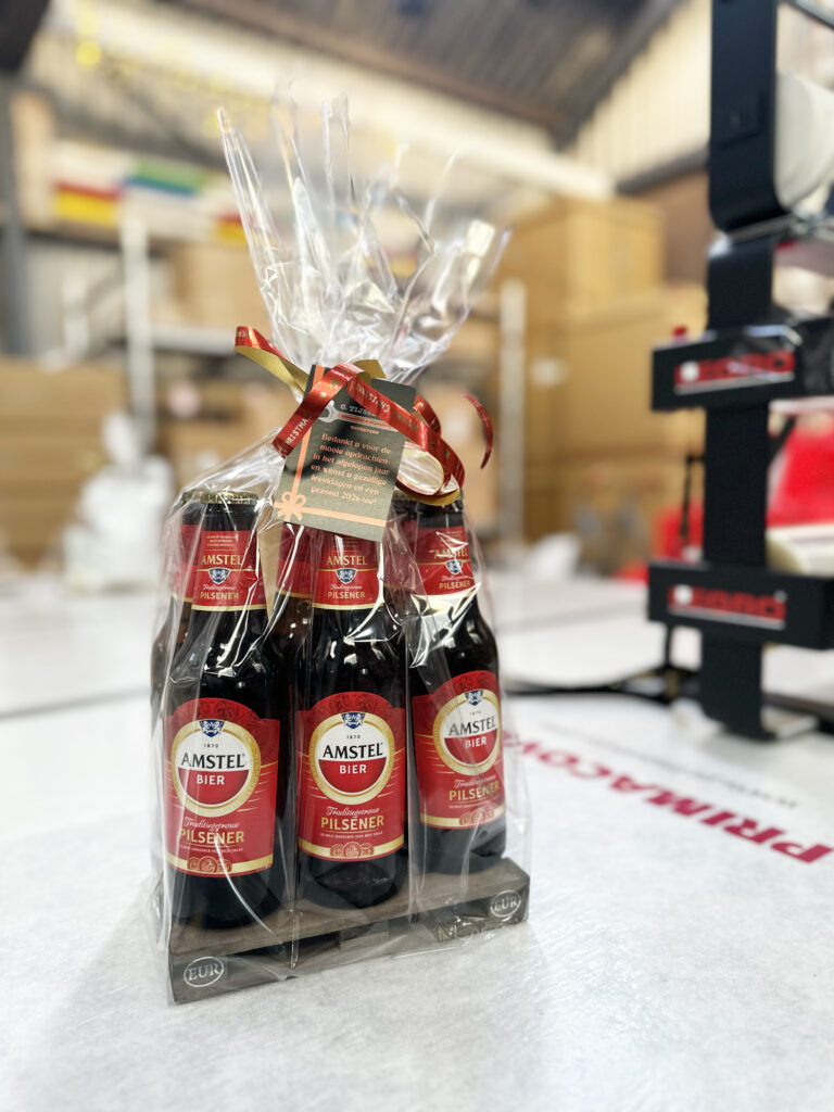 Zespak Amstel bierflesjes verpakt in cellofaan met lint